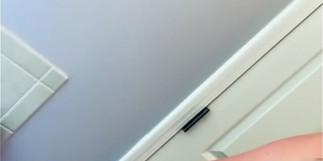 amateur,busty,couple,fake tits,golden shower,homemade,husband,pissing,wife,